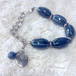 Beaded bracelet with charm; 8” long